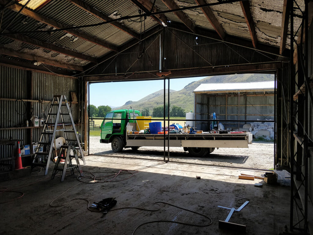 installing doors on the front of the new workshop.