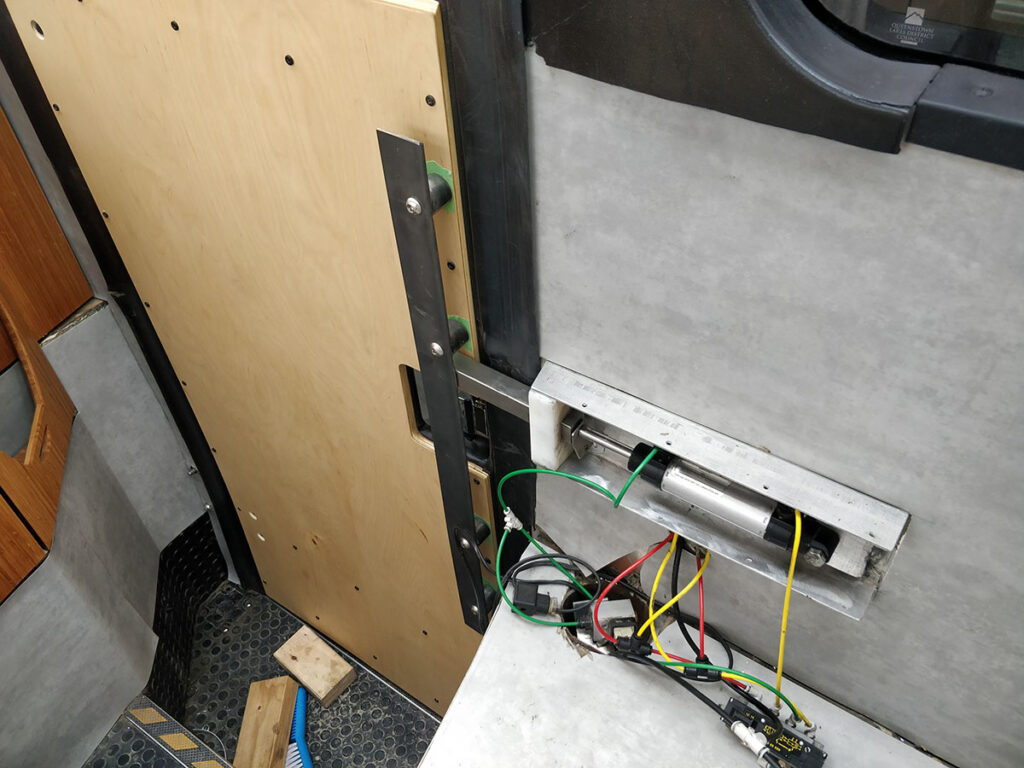 The pneumatic latch that engages with the door handle when the bus is driving.