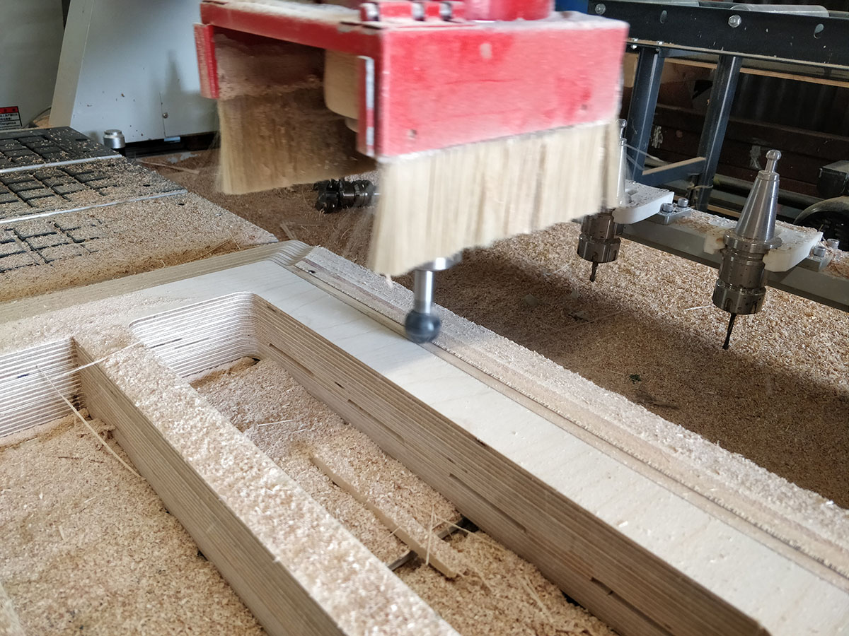 Once the glue has cured we put the sofa/bunk bases back on the CNC for further shaping of the final form with a ball  cutter.