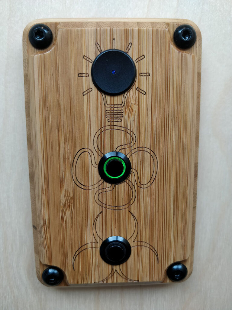 Bathroom light switch plate with fan and macerator pump buttons.